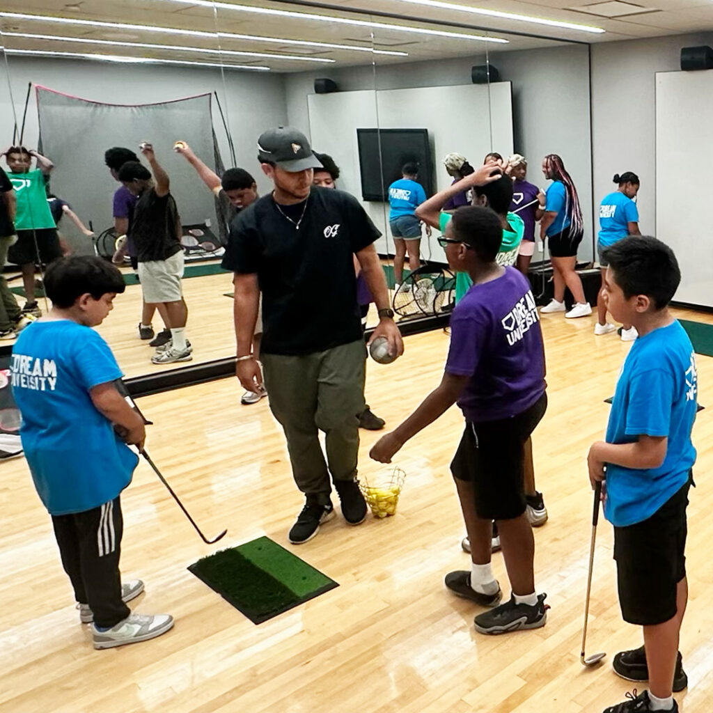 DREAM students with golf instructor Omari Whitmore