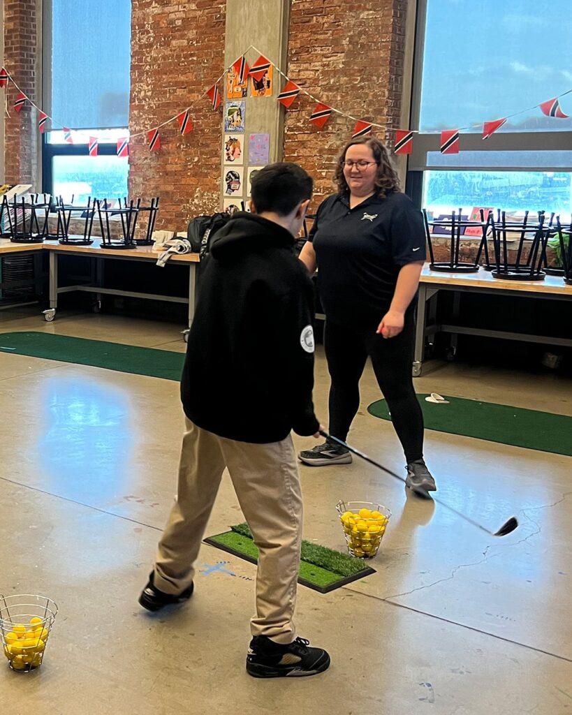 Lily Bartell with Momentum golf student